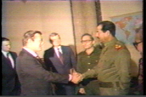 Rumsfeld shaking hands with Hussein, 1983